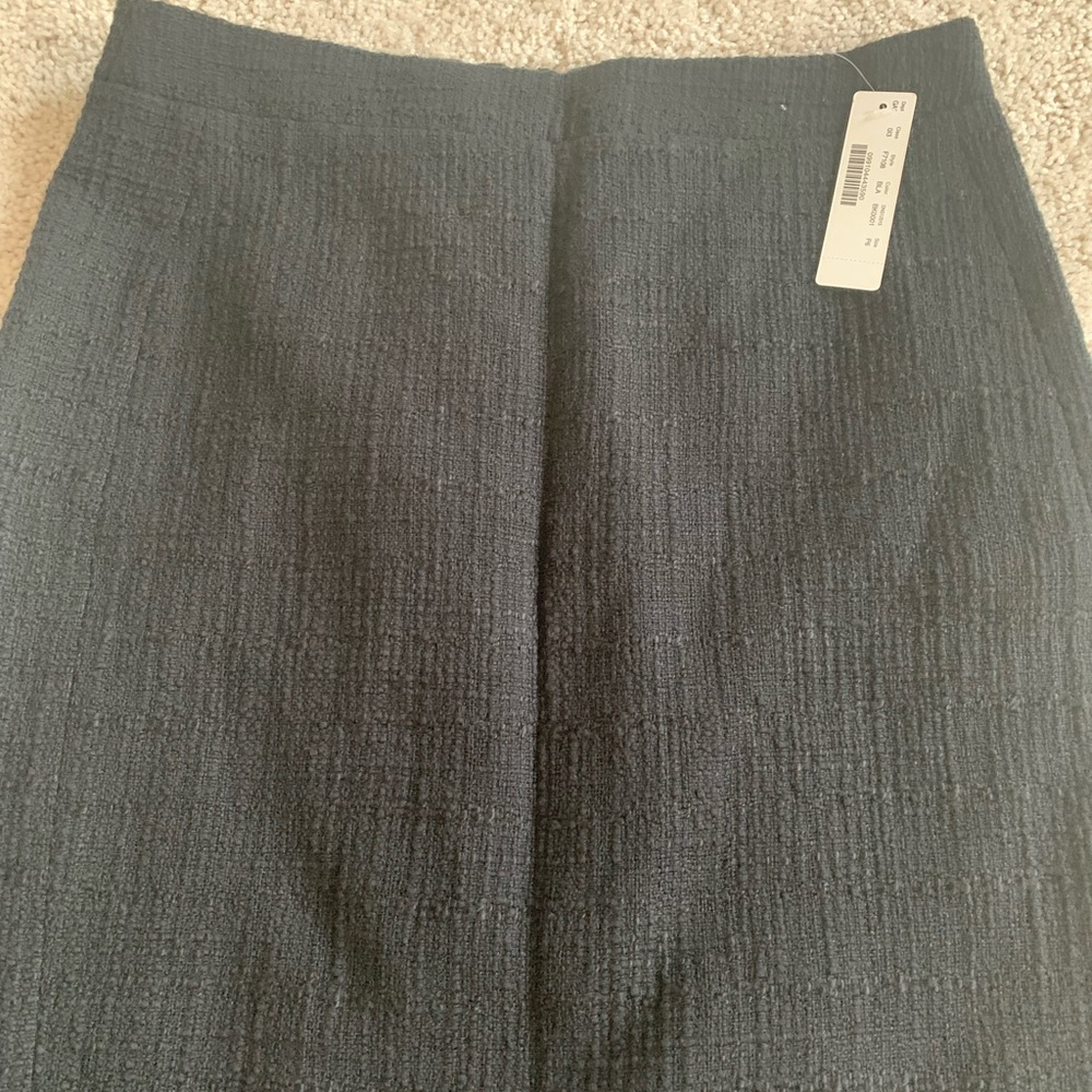 Jcrew skirt. Tags on. Black tweed skirt. With fringe on the bottom. Size 6p.